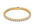 Gold classic tennis bracelet flat lay on white background