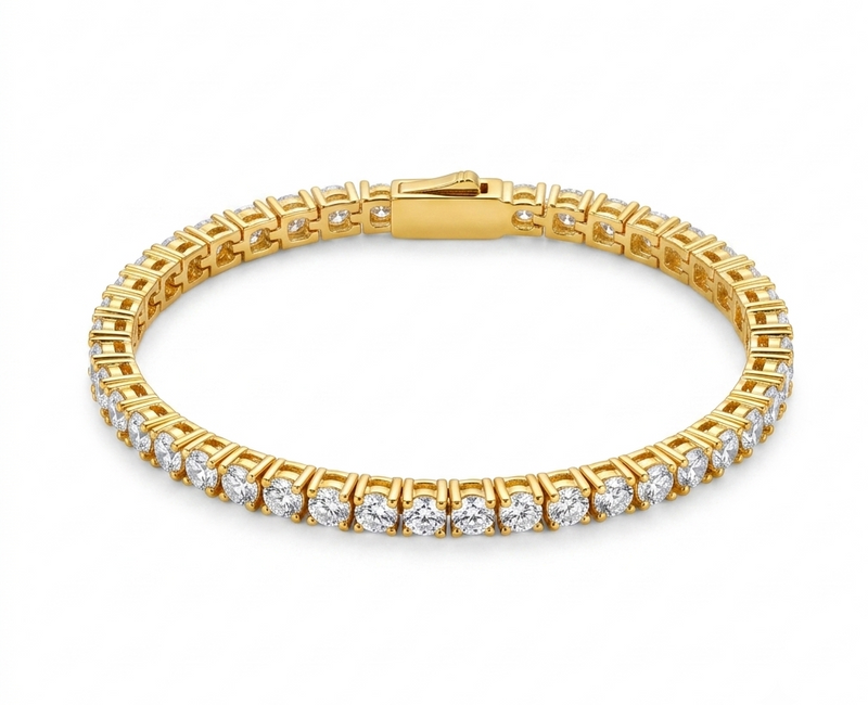 Gold classic tennis bracelet flat lay on white background