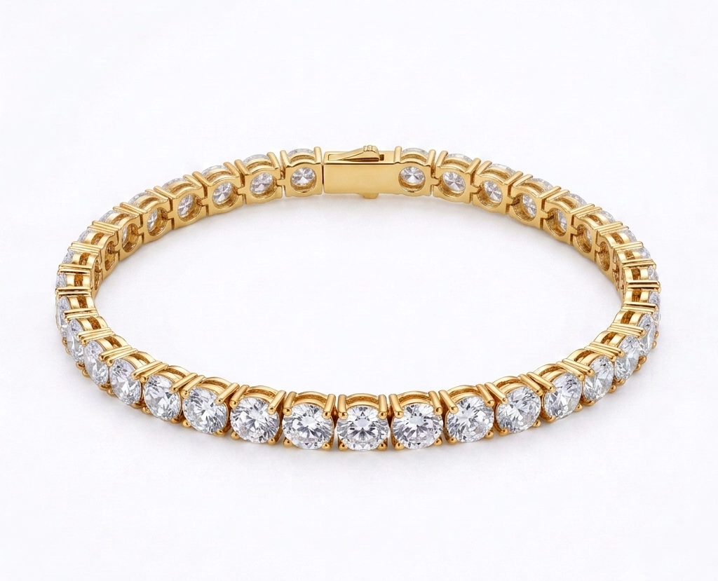 Gold statement tennis bracelet with oversized crystals flat lay on white background