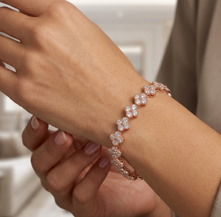 Rose gold clover flower bracelet worn on wrist