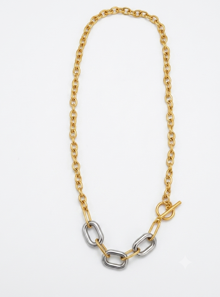 Two-tone toggle chain necklace flat lay on white background