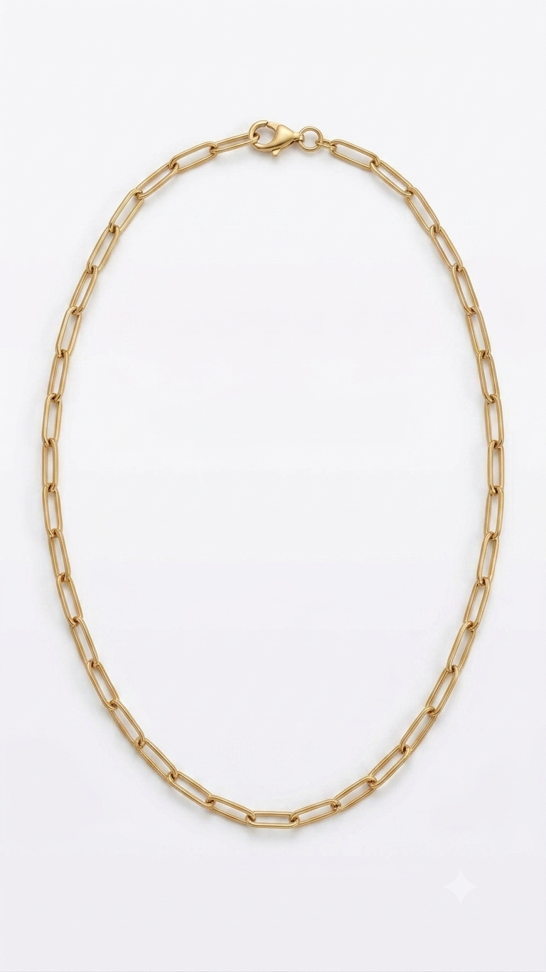 Gold paperclip chain necklace flat lay on white background