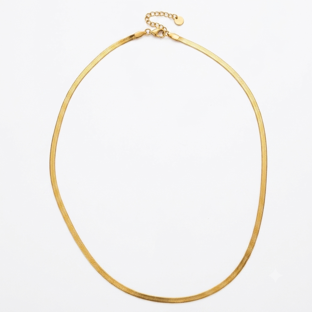 Gold herringbone chain necklace flat lay on white background