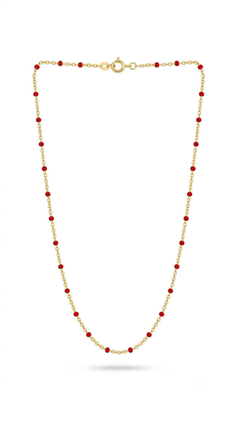 Gold red enamel bead station necklace on white background