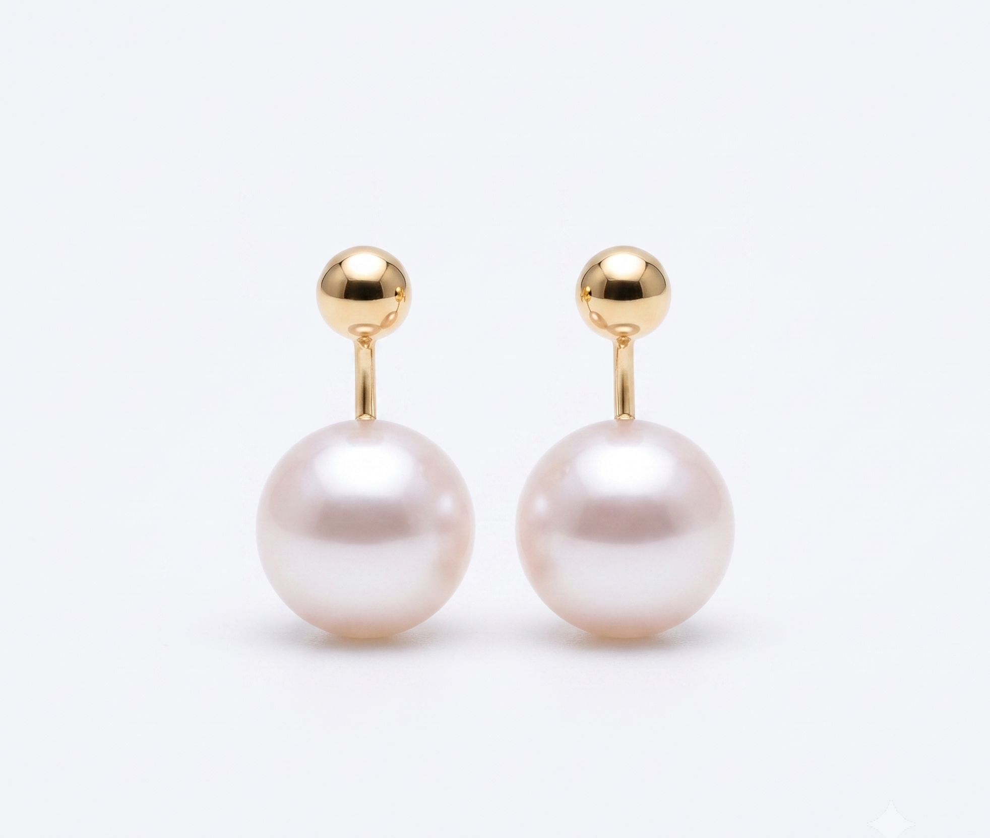 Gold ball and pearl jacket earrings product shot